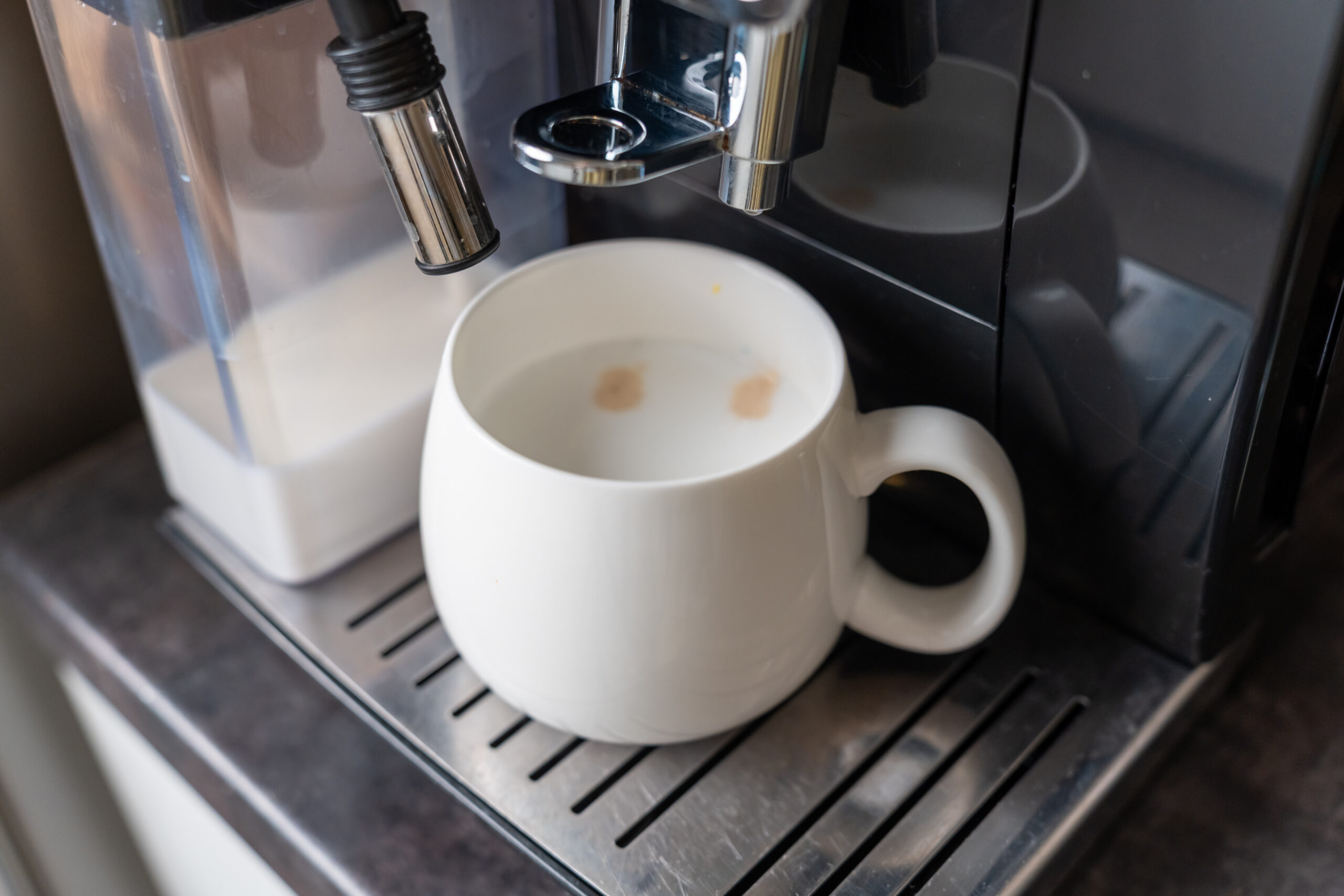 White ceramic cup with fresh latte